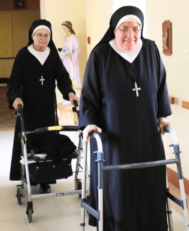 Senior Sisters with walkers