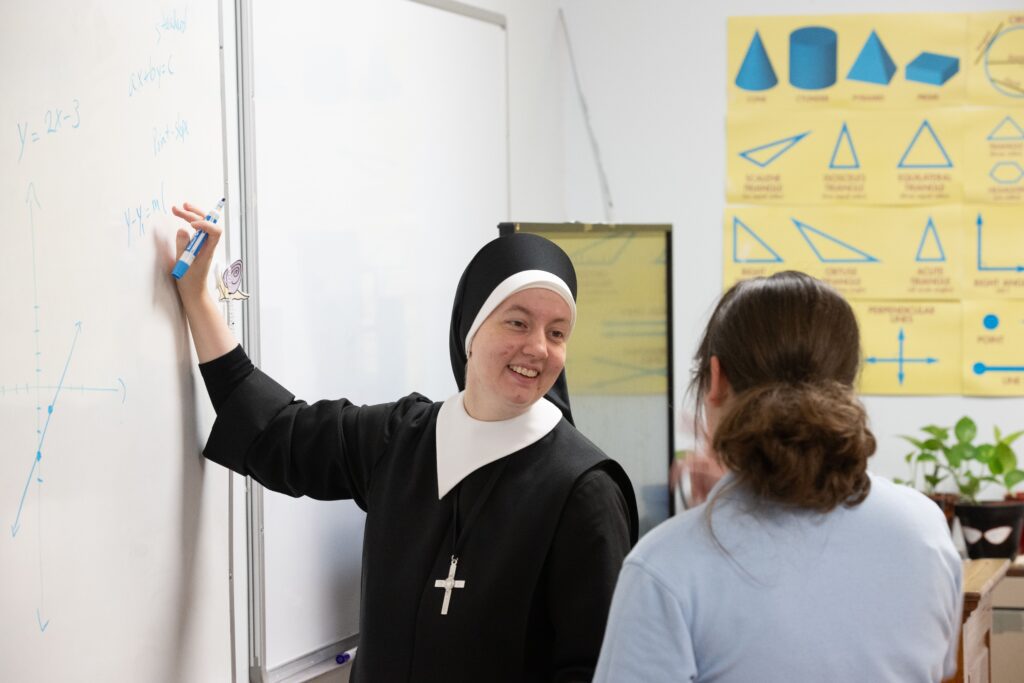 Sister using whiteboard and chatting with student